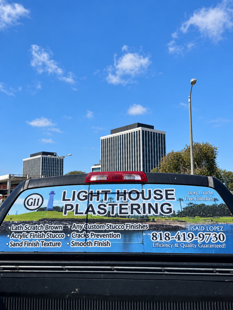 Light House Plastering work truck with business contact details
