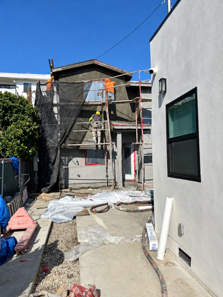 Residential stucco project with scaffolding in place